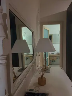 a bedroom with a bed and a chair in it at San Francesco Living in Rome