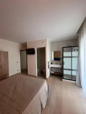 a bedroom with a bed and a television in it at San Francesco Living in Rome