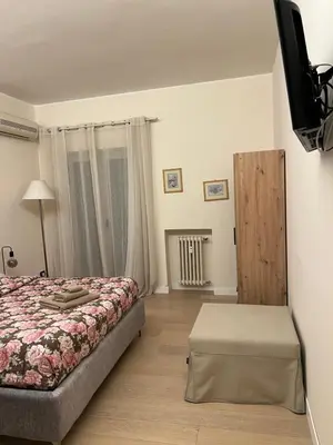 a dining room with a table and a window at San Francesco Living in Rome