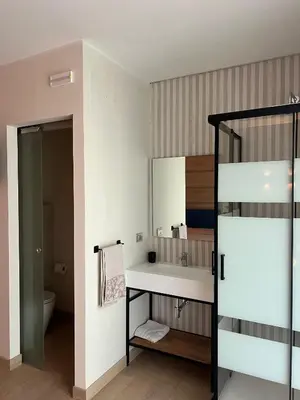 a bathroom with a sink and a toilet at San Francesco Living in Rome
