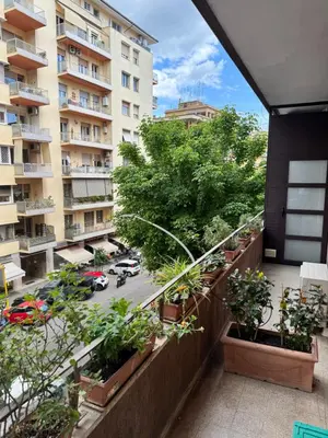 an apartment balcony with a view of a street at San Francesco Living in Rome