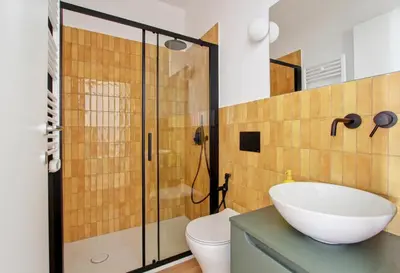 a bathroom with a sink and a toilet and a shower at Roma Academia Style by the Halls of Knowledge in Rome