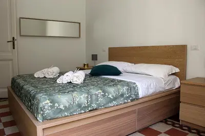 a bedroom with a bed with towels on it at Porta del Vaticano in Rome