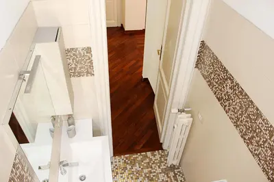 a bathroom with a staircase with a tile floor at Porta del Vaticano in Rome