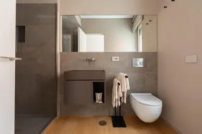 a bathroom with a sink and a toilet at Popolo Design Apartment by RomeLoft in Rome