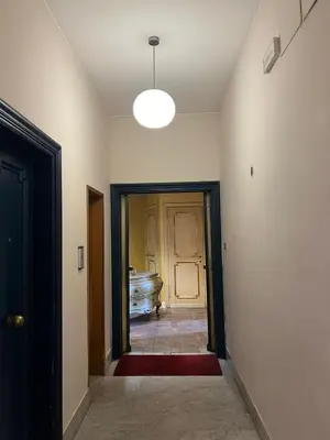 an empty hallway with a door and a room at Antico Suites Roma in Rome