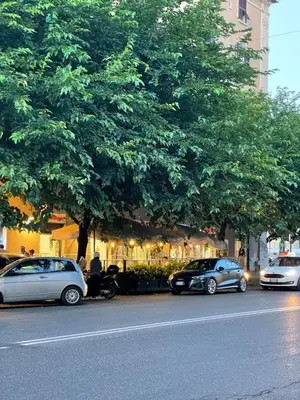 a group of cars parked on the side of a street at Casa Betania in Rome