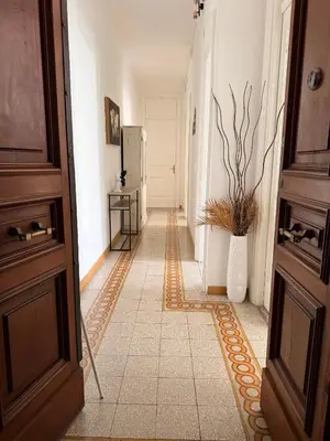 an empty hallway with a floor of tiles at Qflat Elegant Palumbo Vatican in Rome