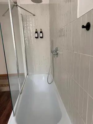 a shower with two bottles on the wall in a bathroom at Qflat Elegant Palumbo Vatican in Rome