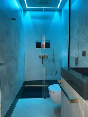 a bathroom with a toilet and a glass shower at Borghese Boutique in Rome