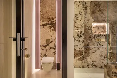 a bathroom with a toilet and a glass shower at Borghese Boutique in Rome