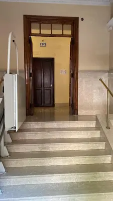 a wooden door with a welcome mat in front of it at Casa di latta in Rome