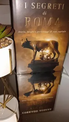 a book sitting on top of a table at Monolocale Stadio olimpico Francia Suite in Rome
