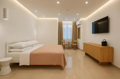 a hotel room with a bed and a television at NERI Vatican Suite in Rome