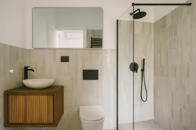 a bathroom with a shower with a toilet and a sink at NERI Vatican Suite in Rome