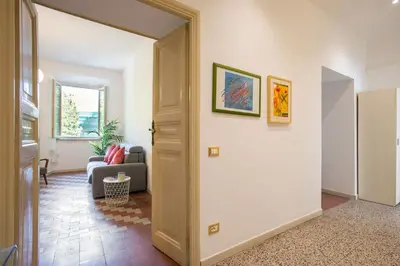 an open door into a living room with a couch at Casa Mia in Rome