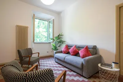 a living room with a couch and two chairs at Casa Mia in Rome