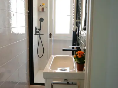 a bathroom with a sink and a shower at La Casa dei Lettori in Rome