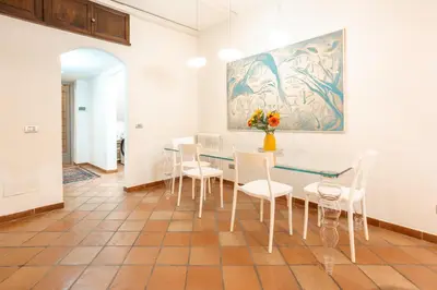 a patio with a table and chairs on a patio at Casa Verde - Luxury apartment in Trastevere in Rome