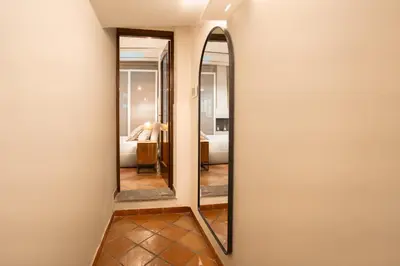 a living room with a couch and a table at Casa Verde - Luxury apartment in Trastevere in Rome