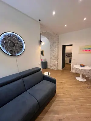 a living room with a couch and a table at Casa Vacanze Villa Barberina in Rome