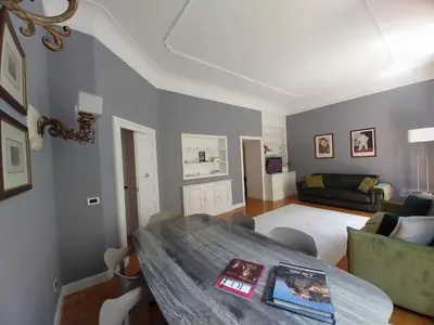 a living room with a table and a couch at A Casa di Vittoria in Rome