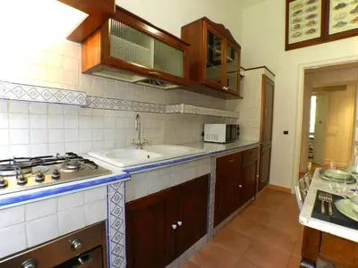 a kitchen with a sink and a counter top at A Casa di Vittoria in Rome