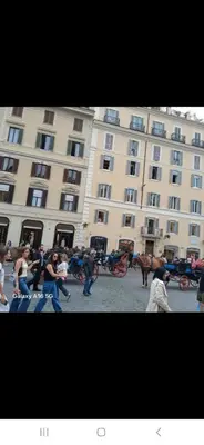 a group of people standing in front of a large building at Vatican Apartaments Holiday in Roma in Rome