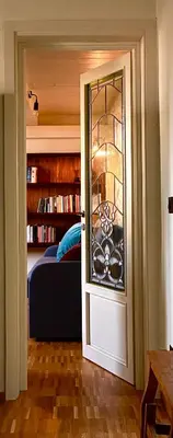 a door leading to a bedroom with a bed at CasaNa' in Rome