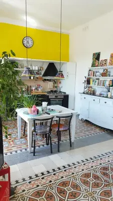 a kitchen with a table and chairs in a room at Casa Alessia a Roma in Rome