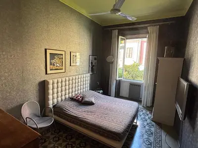 a bedroom with a bed and a window at Casa Alessia a Roma in Rome