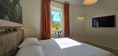 a hotel room with a bed and a window at Elegante Stanza Privata in Centro a Roma Colosseo - FLC Room in Rome in Rome