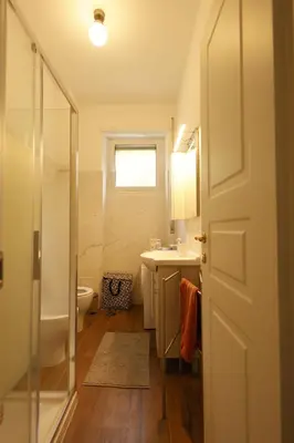 a bathroom with a shower and a sink and a toilet at P-House in Rome