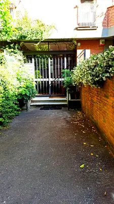 an entrance to a house with a gate at P-House in Rome