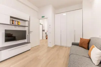 a living room with a couch and a television at Domus urbe San Paolo in Rome