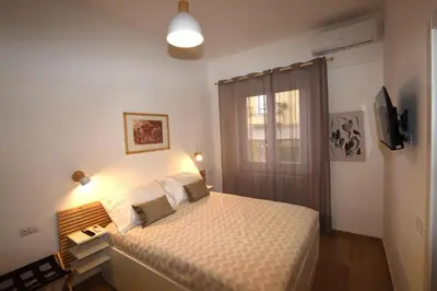 a bedroom with a large bed and a window at LG Apartment - Near Vatican City, Rome in Rome