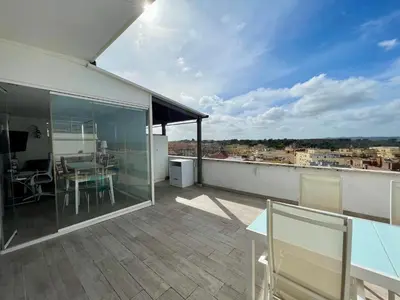 an apartment balcony with a view of a city at YCH-Attico con splendida vista su Villa Ada in Rome