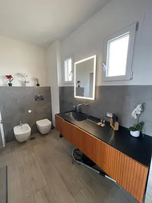 a bathroom with a tub and a toilet and a sink at YCH-Attico con splendida vista su Villa Ada in Rome