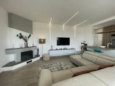 a living room with a couch and a fireplace at YCH-Attico con splendida vista su Villa Ada in Rome