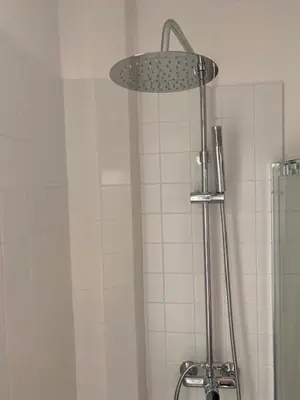 a shower with a shower head in a bathroom at Civico 18 in Rome