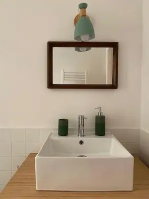 a bathroom with a white sink and a mirror at Civico 18 in Rome