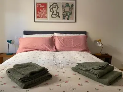 a bed with some blankets and pillows on it at Civico 18 in Rome
