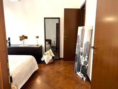 a bedroom with a bed and a picture of a city at ValGa Suite near Vaticano and Centre in Rome