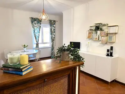 a living room with a table and a dining room at ValGa Suite near Vaticano and Centre in Rome
