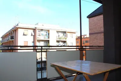 a wooden table sitting on top of a balcony at ValGa Suite near Vaticano and Centre in Rome