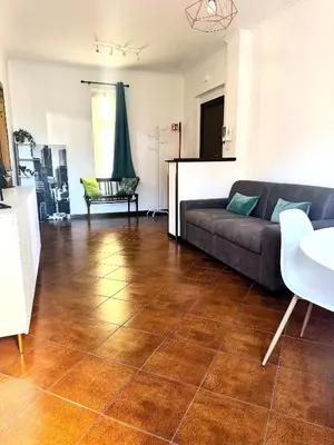 a living room with a couch and a tile floor at ValGa Suite near Vaticano and Centre in Rome