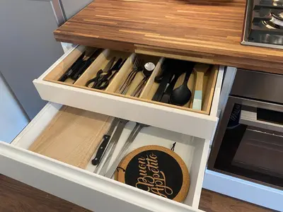 a kitchen drawer filled with cooking utensils at Leone's rooms - House for 6 people in Rome