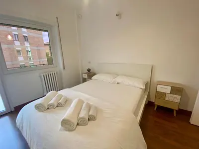 a bedroom with two beds with towels on them at Leone's rooms - House for 6 people in Rome