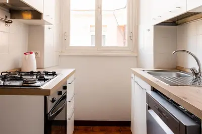 a kitchen with a stove and a sink at Casa Medea in Rome