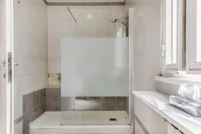 a shower with a glass door in a bathroom at NEW OPENING Free Netflix BIG APT Pamphili House in Rome